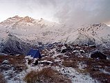 501 Camp On Top Of The World Ridge Returning from Annaurna North Base Camp Sun hit our camp at the first French Annapurna North Base Camp at eight o�clock as we were breaking camp. Left at 8:15. We hiked back down to the Miristi Khola, and crossed it again on the log, arriving on the far bank at 10:30. We had an early lunch of Tibetan momos, fried potatoes in curry sauce, and coleslaw. We left the Miristi Khola at 12:15 and climbed up and up, forever up until at 14:30 we reached the first stream, where we set our camp. The weather on arrival was hail and 2C.